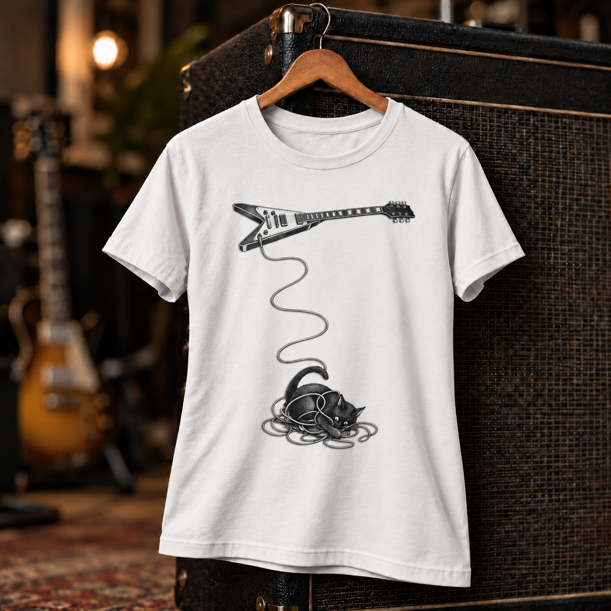 Wired unisex tee styled on a studio set – cat tangled in a guitar cable